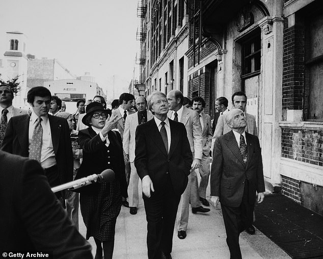 Near the beginning of his presidency, Carter visited the South Bronx, accompanied by New York politicians Patricia Harris (left) and Mayor Abraham Beame (right)