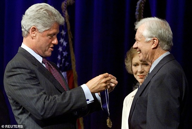 Former President Bill Clinton presented Carter with the Presidential Medal of Freedom in 1999 (photo)