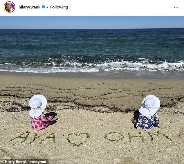 In her photo, she posed with her hand resting on her daughter Aya or son Ohm's head as they admired the ornaments.