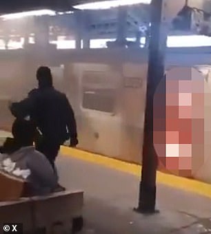 MTA police were seen walking past the unidentified woman as she burned