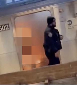 MTA police were seen walking past the unidentified woman as she burned