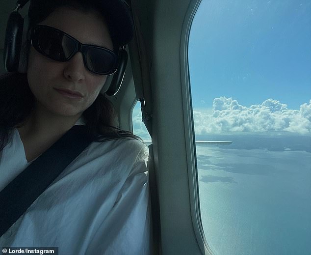 The second image showed Lorde riding in a helicopter, again wearing sunglasses, with a stunning view from the window.