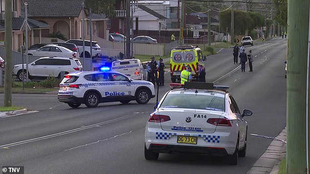 Police described the shooting as a targeted attack (pictured, police at the scene)