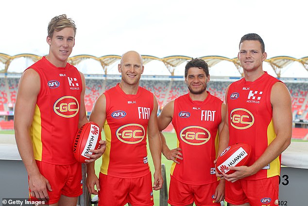 May (right) and Prestia (second from right) played together on the Gold Coast and joined the Suns in 2010.