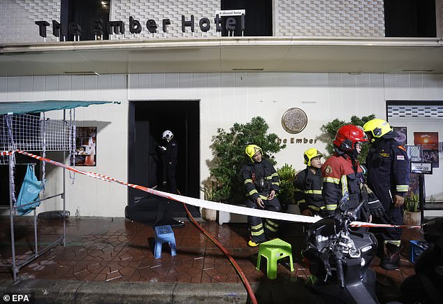 Firefighters at the scene of the fire at the Ember hotel in Bangkok