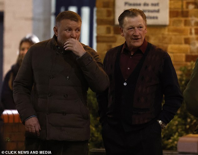 Guy is seen with an actor on set as they film scenes in the boxing gym.