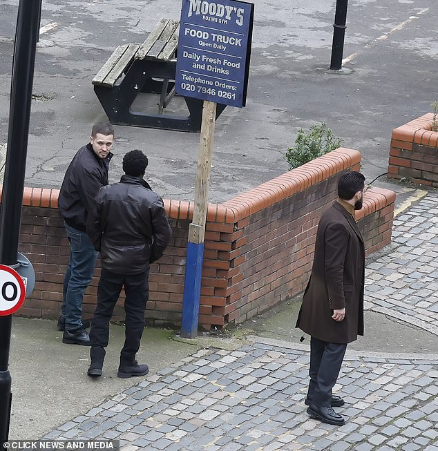 The actors of the gangster drama are seen hanging around outside the boxing gym while the cast films scenes.