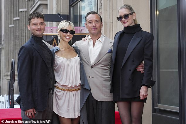 Rafferty (left) and Iris Law (second left) with his father Jude and his second wife, Phillipa Coan, at the actor's new star ceremony on the Hollywood Walk of Fame in December.