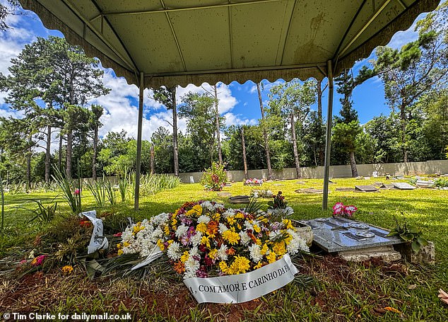 The graves of Tatiana Denize Silva dos Santos, 43, and Neuza Denise Silva dos Anjos, 65, at the Sao Vicente cemetery in Porto Alegre, Brazil