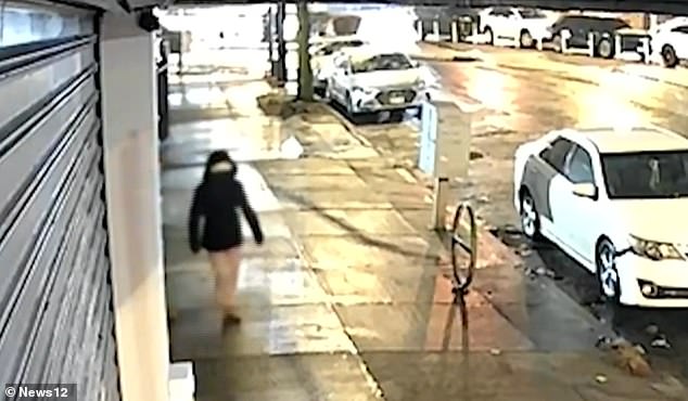 She was then seen stopping in front of several houses on the street before turning around, opening a door and leaving the scene without the bag in her hand.