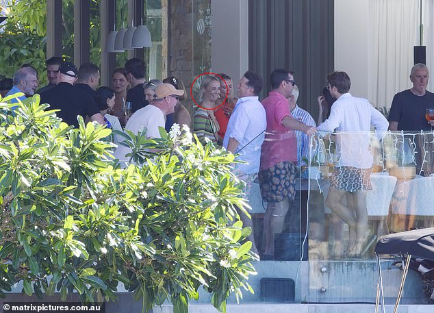 Tellingly, Michael's ex-girlfriend, Jade Yarbrough (circled), was at the party. Here she is seen chatting with her brother-in-law Karl.