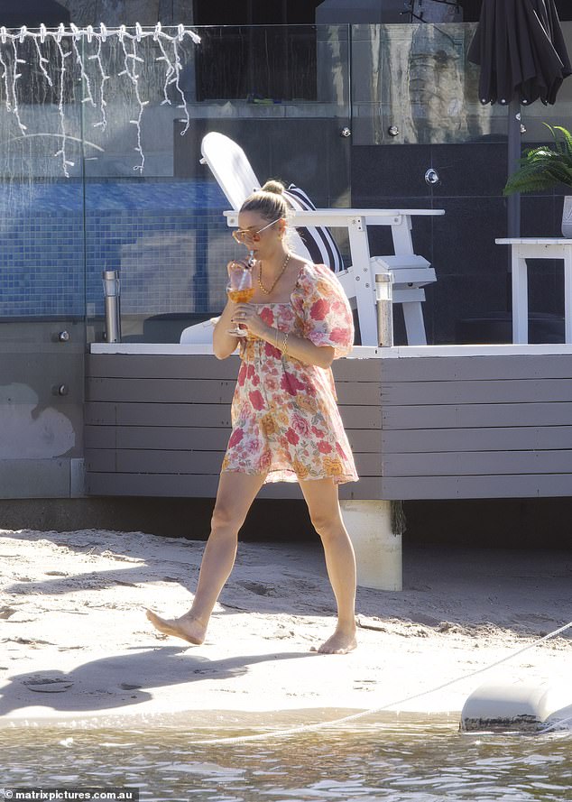 Jasmine was seen enjoying a cocktail while soaking up the warm Queensland sun.