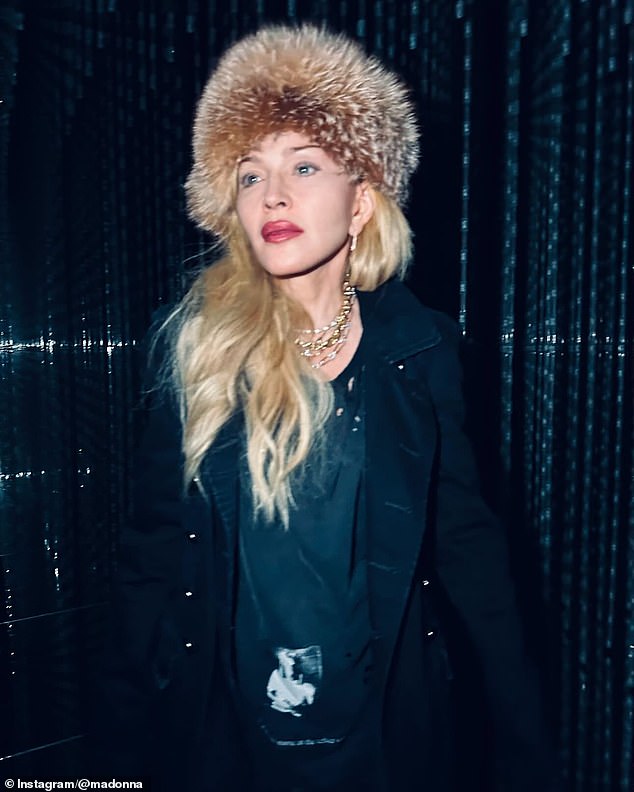 She also shared a photo of her outfit, which included many gold chains around her neck and a furry hat on her head.