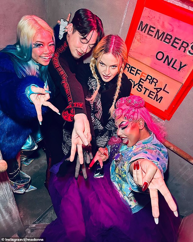 Her post also included a photo of her posing with drag queens and throwing peace signs.