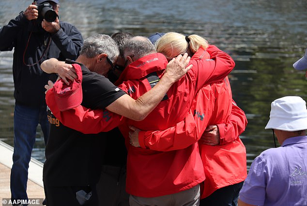 Several people gathered (pictured) to remember the deceased sailors.