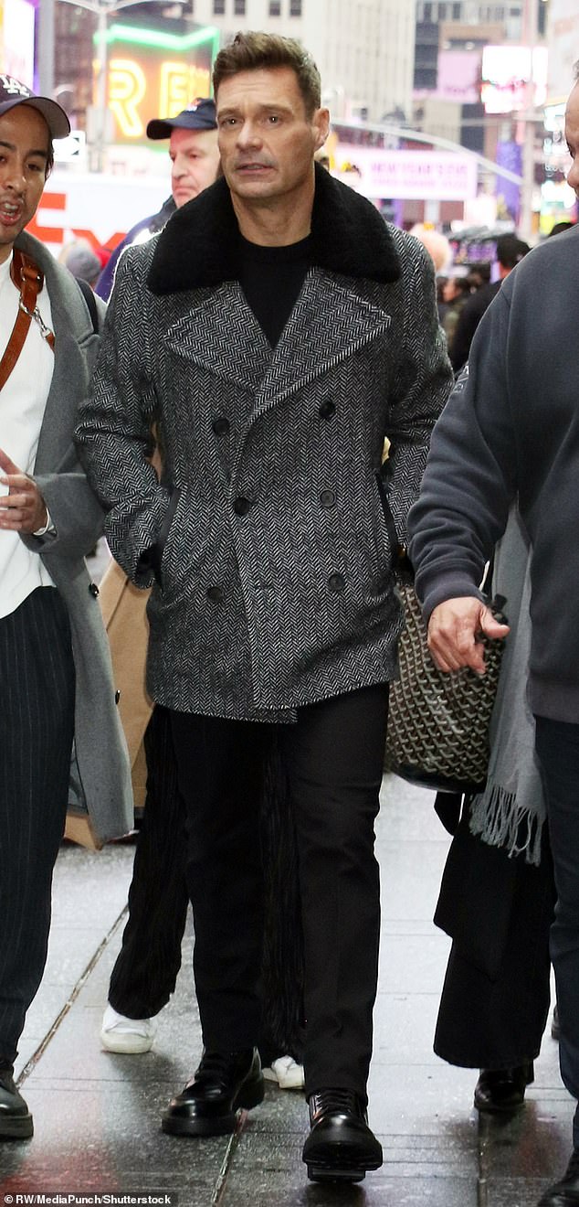 Seacrest was on-trend in a black and white double-breasted peacoat with a sleek fur collar.