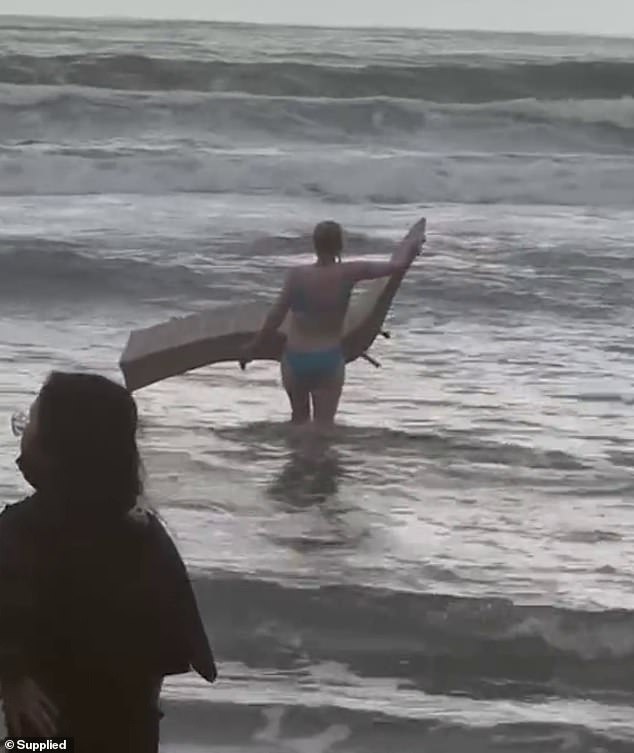 Ms. Fuller carried a beach chair cushion into the water as a flotation device to help Mr. Vennix get to shore.