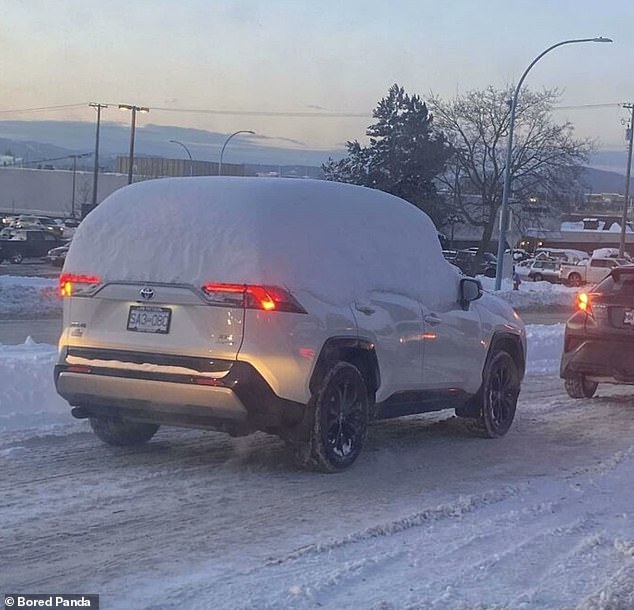 Snow prank! This motorist decided to go out for the day with his car (and its windows) still completely covered in snow.