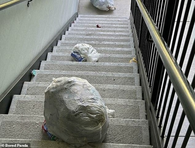 Trash neighbors! This resident discovered that his neighbor decided to throw his trash bags down the stairs instead of putting them in the trash can.