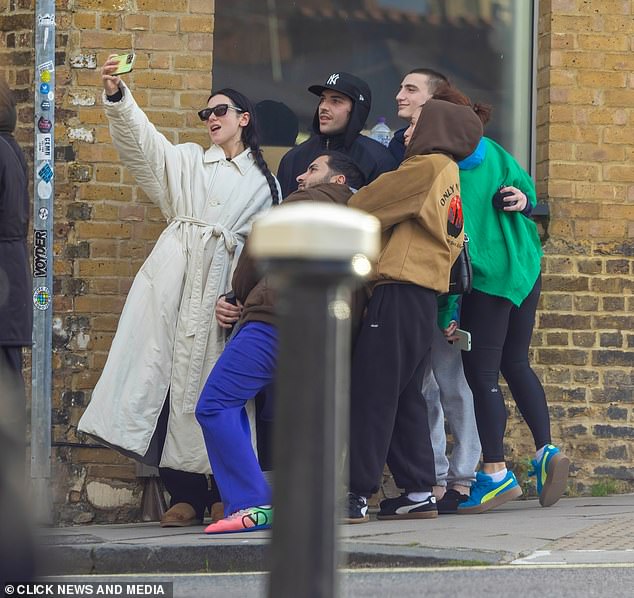 The singer was joined by a group of friends for the outing and the hitmaker took a photo of the gang outside the studio.