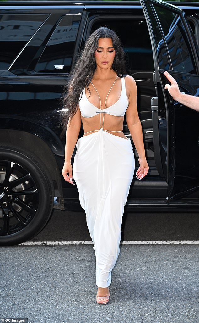 Kim also showed some skin in this white dress in Midtown Manhattan on August 14, 2024.