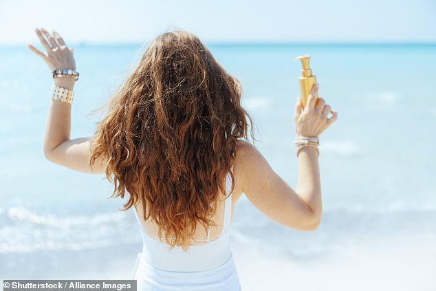 Research shows that while 65 percent of people use sunscreen on their skin, only 18 percent use it on their hair (stock)