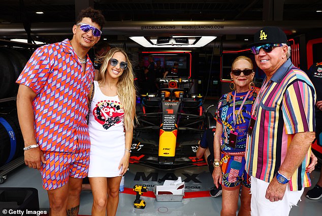 In 1973, Walton Laurie graduated with a degree in English from the University of Memphis, where she met her future husband, Bill Laurie (right). Pictured: Patrick Mahomes, Brittany Mahomes, Nancy Walton Laurie and Bill Laurie pose for a photo outside the Red Bull Racing garage in Miami, Florida.