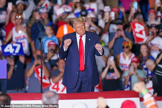 Donald Trump dances in front of the YMCA during a rally in Greensboro, North Carolina in October