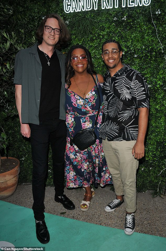 And he added: 'And the things he says to me... are so charming. It's like a puzzle; we fit in and everything works out' (Pictured with her boyfriend David and son Aidan in June)