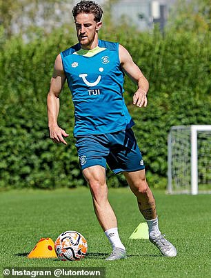 Tom Lockyer has returned to training with Luton eight months after suffering cardiac arrest during a Premier League match