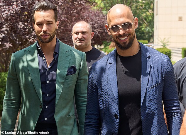 Andrew Tate is pictured leaving the Bucharest court with his brother Tristan, 35, on July 4. Devon and Cornwall Police accuse the couple of being 