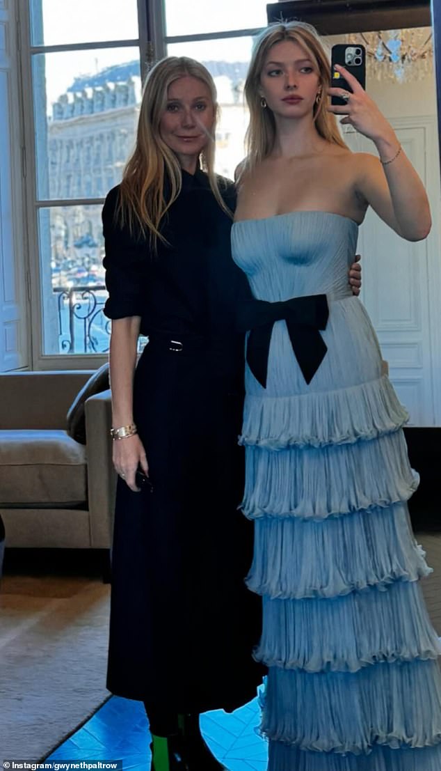 Glamorous family: Apple, who wore a strapless chiffon dress from Valentino's Spring 2025 collection, posed with her famous mother Gwyneth Paltrow