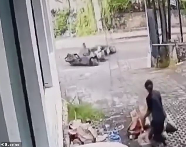 The horrific clash between the scooter drivers was captured on CCTV.