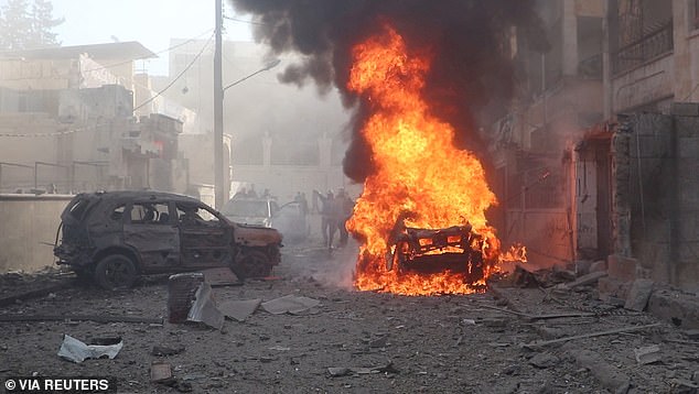 A view of a vehicle on fire after what the White Helmets say is an attack, in Idlib, Syria, released December 1, 2024.