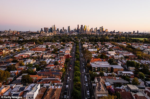 Surveying firm Quantify RLB has forecast construction costs will continue to rise as Australia faces a worsening housing crisis (pictured, aerial view of Melbourne)