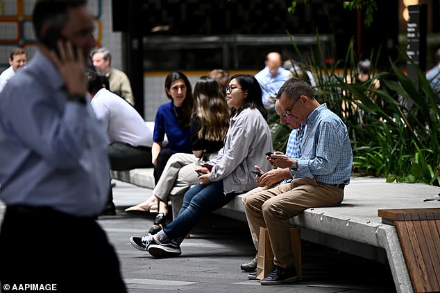 The threat of return-to-work mandates comes after many businesses canceled or reduced work-from-home privileges this year (pictured, Sydney CBD office workers)