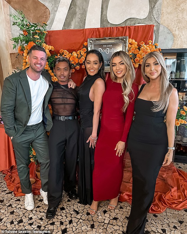 Justin McKeone (left) puts his arm around former Masterchef contestant Khanh Ong. The Bachelor Australia 2021's Tahnee Leeson, who posted the image just a few days ago, is dressed in red.