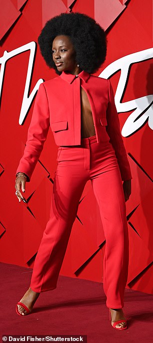 AJ Odudu made sure to make a statement as she went braless underneath a striking red jacket and tailored trouser set.