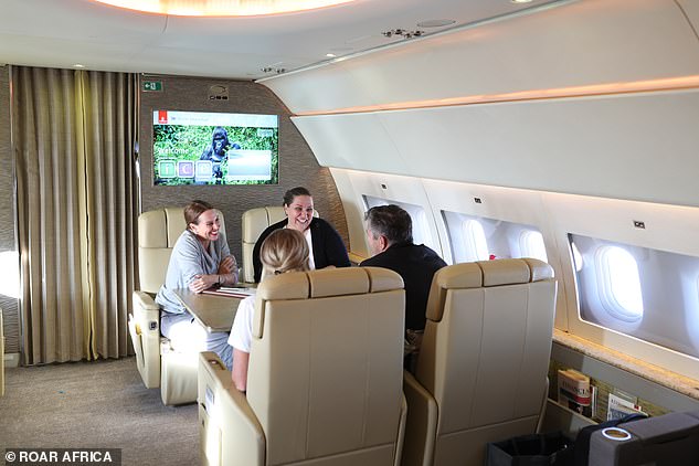 Deborah (left) chats with guests on the Greatest Safari private jet