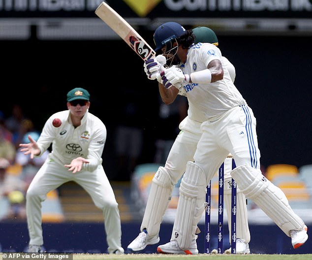 Smith showed remarkable reflexes to stay on the edge of Nathan Lyon's bowling (pictured right, Indian batsman KL Rahul)