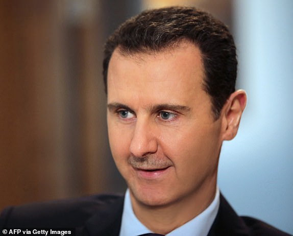 (FILES) Syrian President Bashar al-Assad listens to a question during an exclusive interview with AFP in the capital Damascus, February 11, 2016. Assad is under increasing pressure as his army suffers setbacks , the economy deteriorates, its support declines, and its government's support Foreign backers focus elsewhere. The rapid fall of Aleppo in the last week of November 2024 to Islamist-led rebels and their subsequent advances into central Syria have shaken its legitimacy and emboldened its opponents, analysts said. (Photo by JOSEPH EID/AFP) (Photo by JOSEPH EID/AFP via Getty Images)