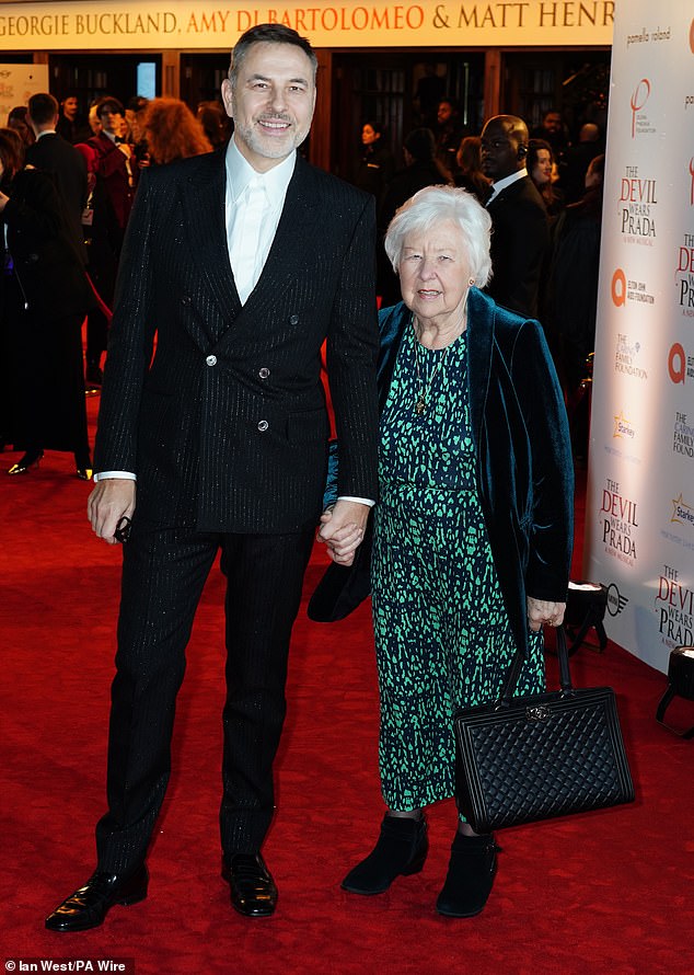 He was photographed smiling as he held hands with his beloved mother Kathleen, walking her down the red carpet to the elegant event, which was packed with famous faces.