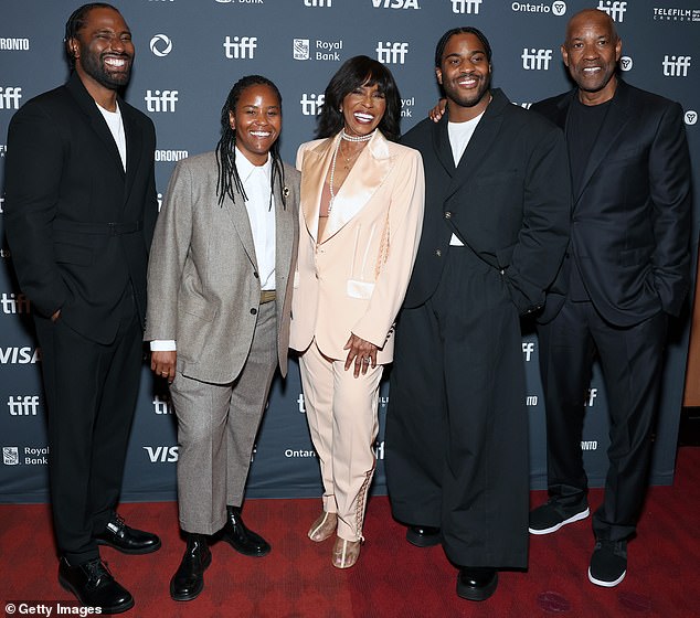 Denzel (right) posed with his wife Pauletta (center) and three of their children (left to right) John David, Katia and Malcolm at the Toronto International Film Festival in September.