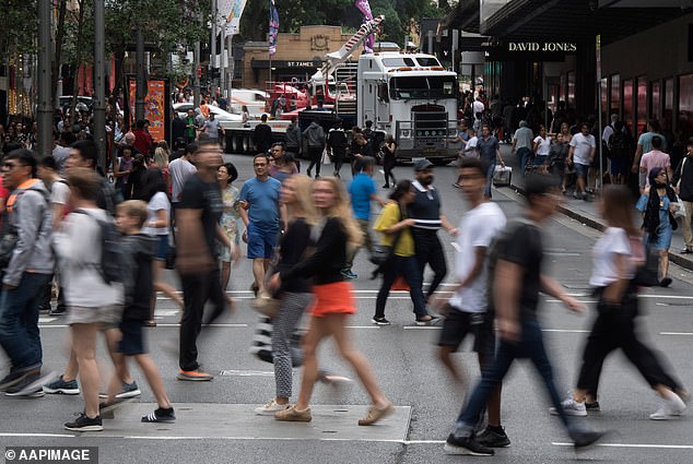 Australia's immigration levels have soared to record levels above 500,000 during a rental and housing affordability crisis (pictured, Sydney pedestrians)