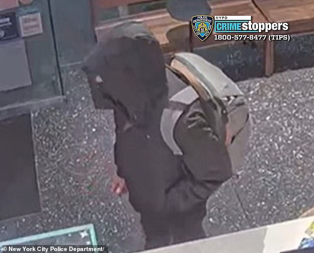 The alleged shooter, complete with backpack, is seen at a Starbucks before the shooting, on Sixth Avenue.