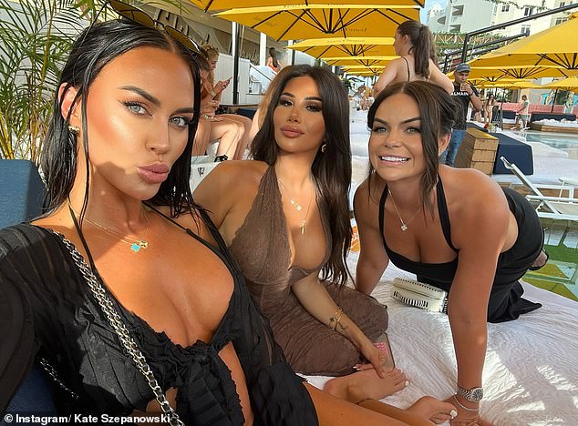 The Instagram star revealed her stunning new look as she flaunted her toned figure in a black crop top and matching colored shorts while out partying with friends.