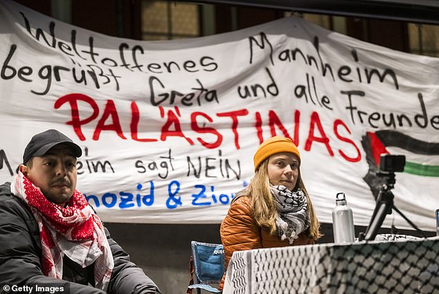 Greta Thunberg and German activist Hassan Ã-zbay (left) speak at a Palestine solidarity event in Mannheim, Germany