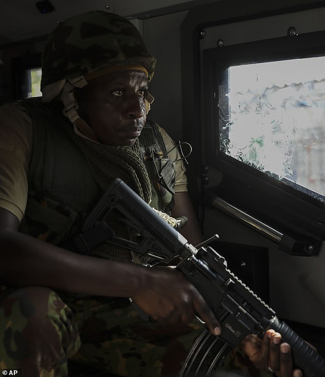 A Kenyan police officer, part of a UN-backed multinational force, patrols a zone in Port-au-Prince, Haiti, on December 5