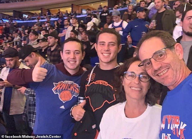 Omer at a sporting event with his parents and younger brother