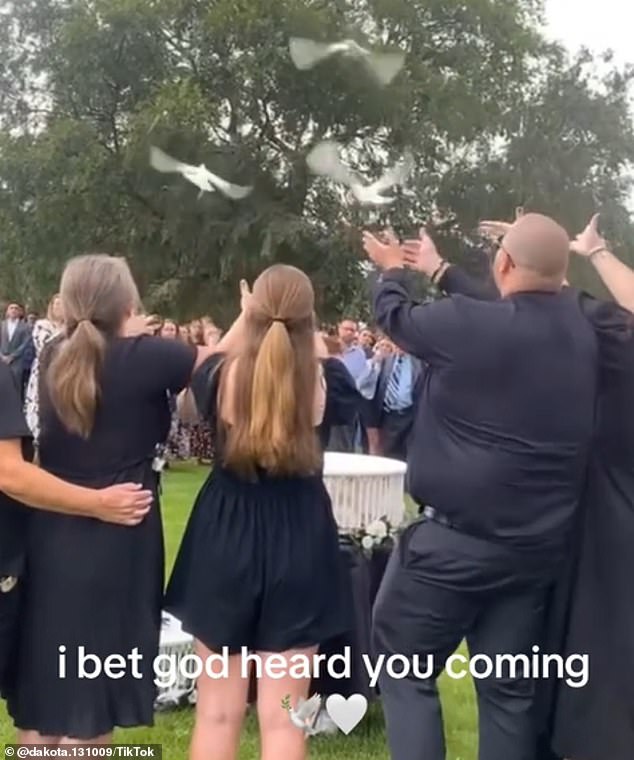 Isaac Walton's parents and siblings released white doves during the ceremony.